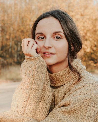 Portrait of Alina Solovei, a participant, smiling warmly.